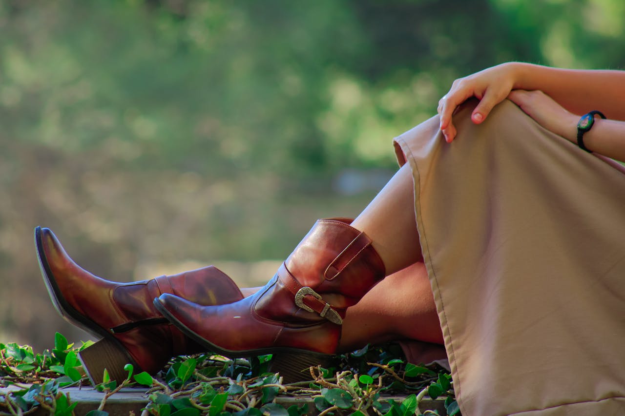 Woman relaxing outdoors wearing cowboy boots in Guanajuatos natural setting.
